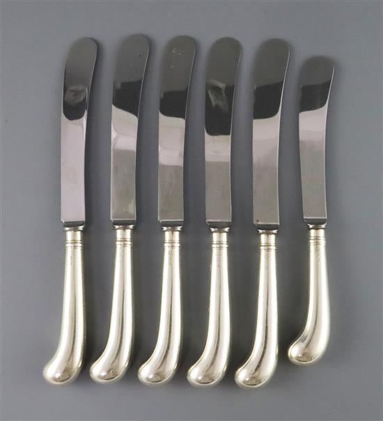 A modern set of twelve silver pistol handled table knives and a similar set of dessert knives, by Cooper Brothers & Sons,